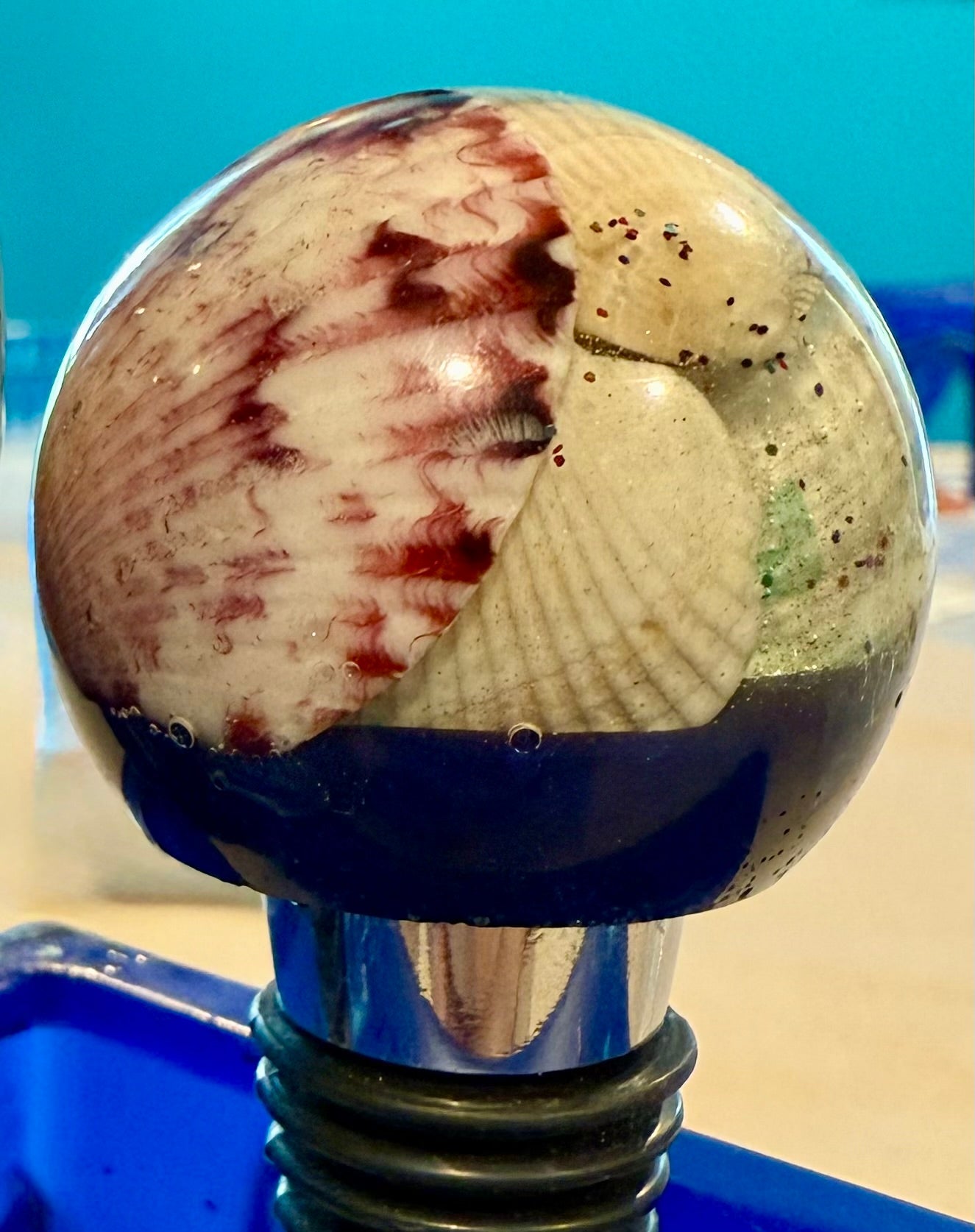 Round topped bottle stoppers made with resin filled with real shells