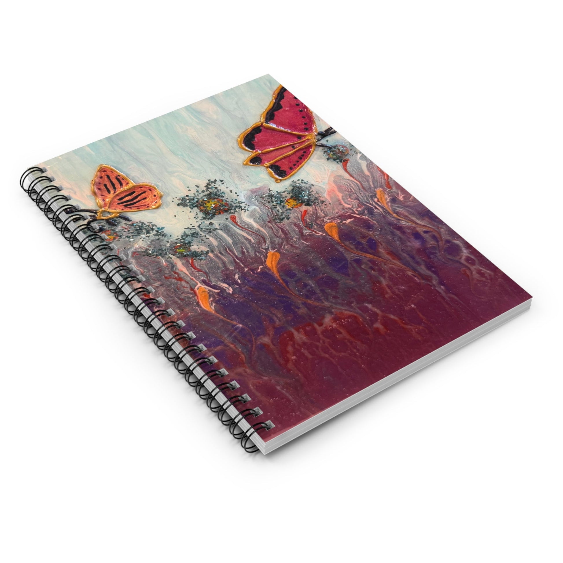 Custom art spiral notebook showing butterflies in a garden.