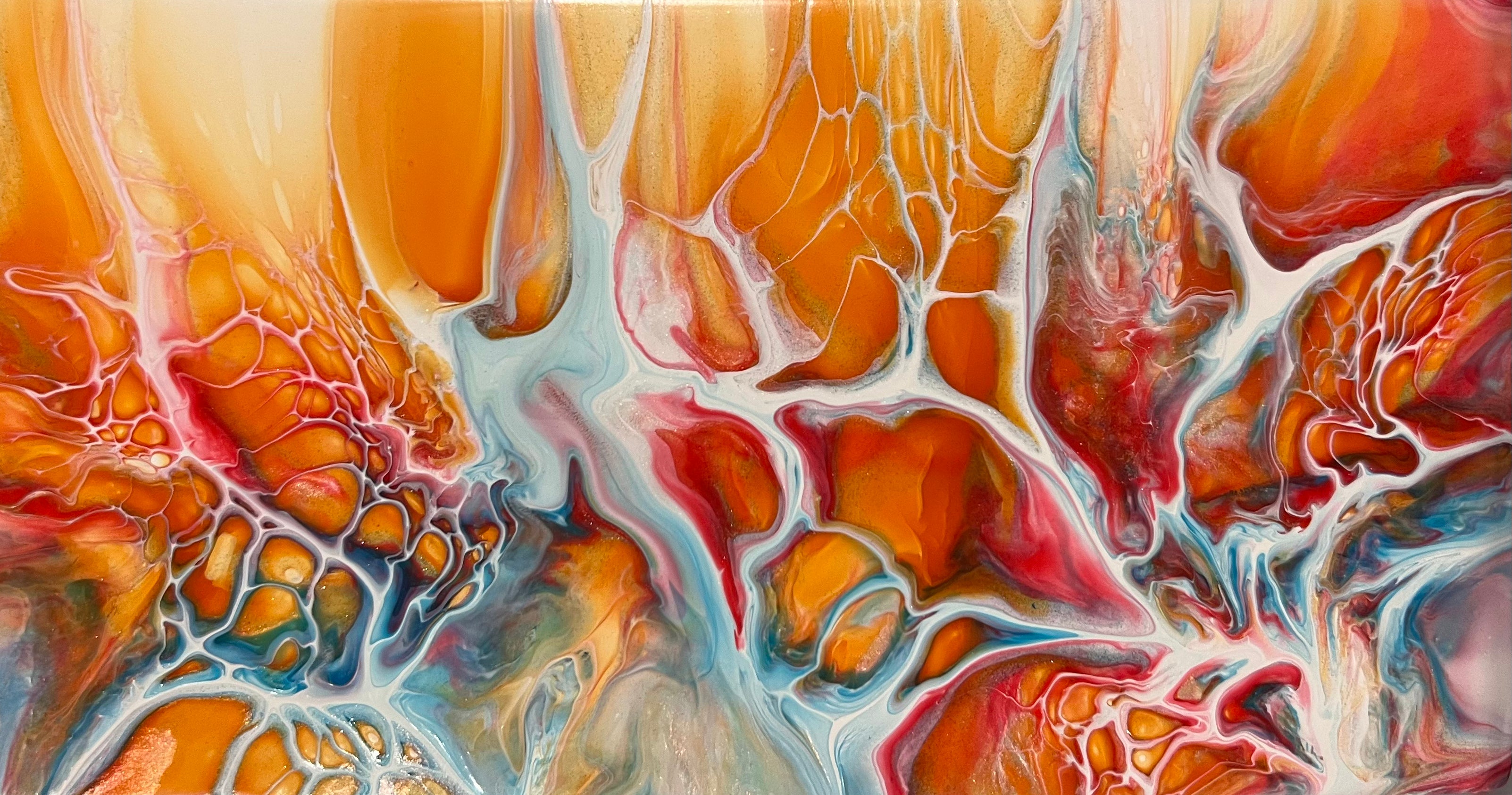 This is an orange and red firey Shellee-art style bloom on a tile. 